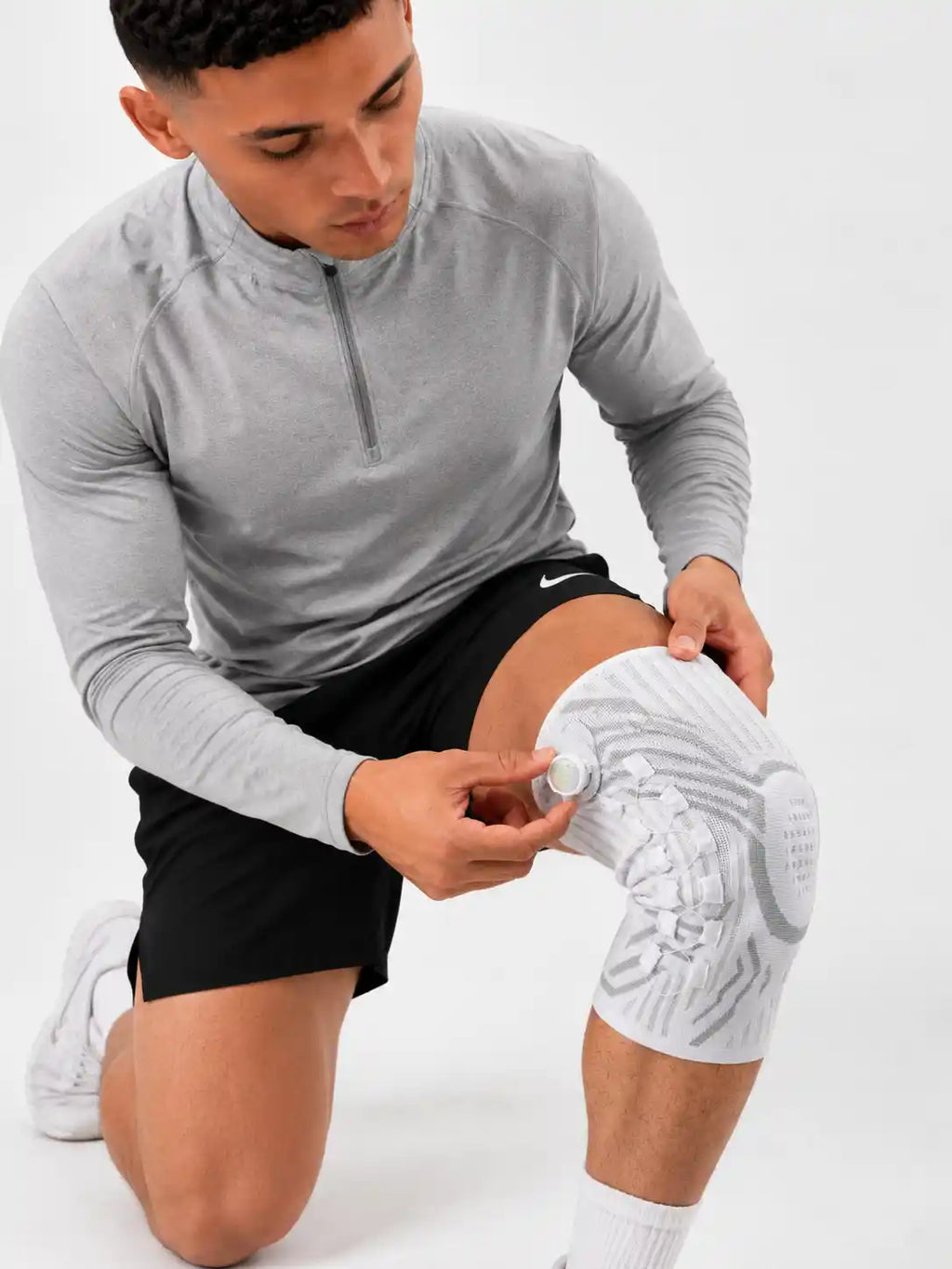 Genouillère de compression réglable respirante pour protection complète